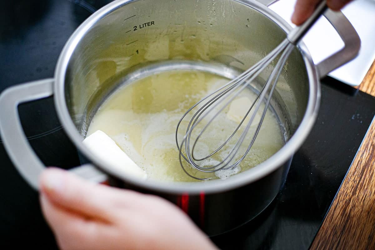 Melting the butter in a pot.