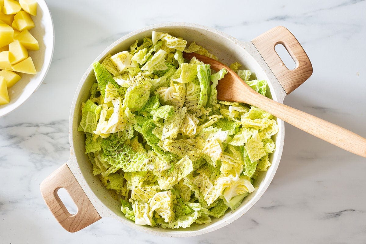 Savoy cabbage added to the pan.