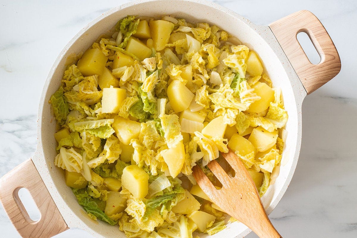 Fully cooked verza e patate dish (cabbage and potatoes).
