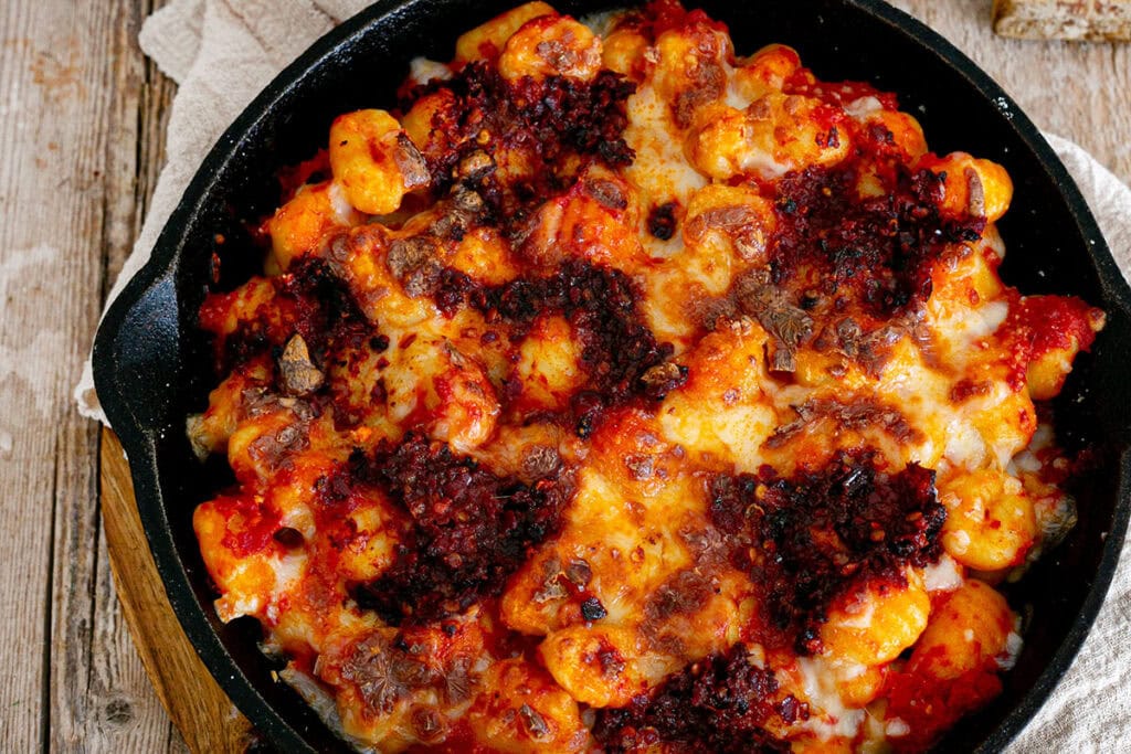 Close-up of gnocchi with nduja and mozzarella.