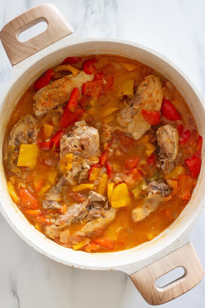 The pollo alla Romana dish fully cooked in a braising pan.