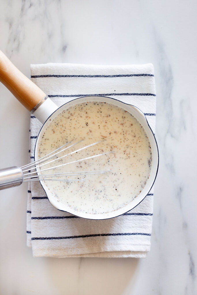 Mixing the milk with vanilla.