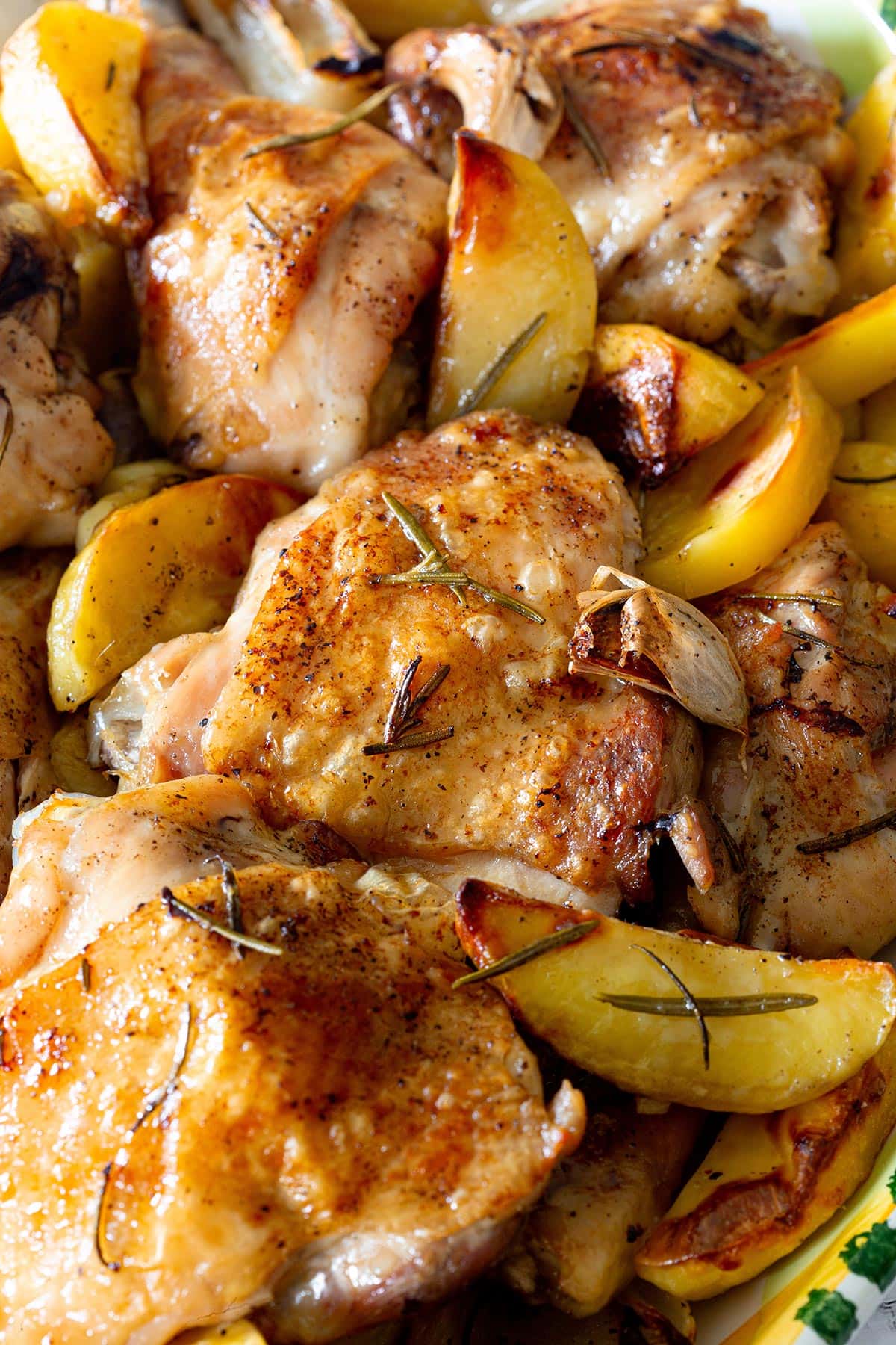 Close-up of crispy and juicy pollo al forno con patate (baked chicken and potatoes).