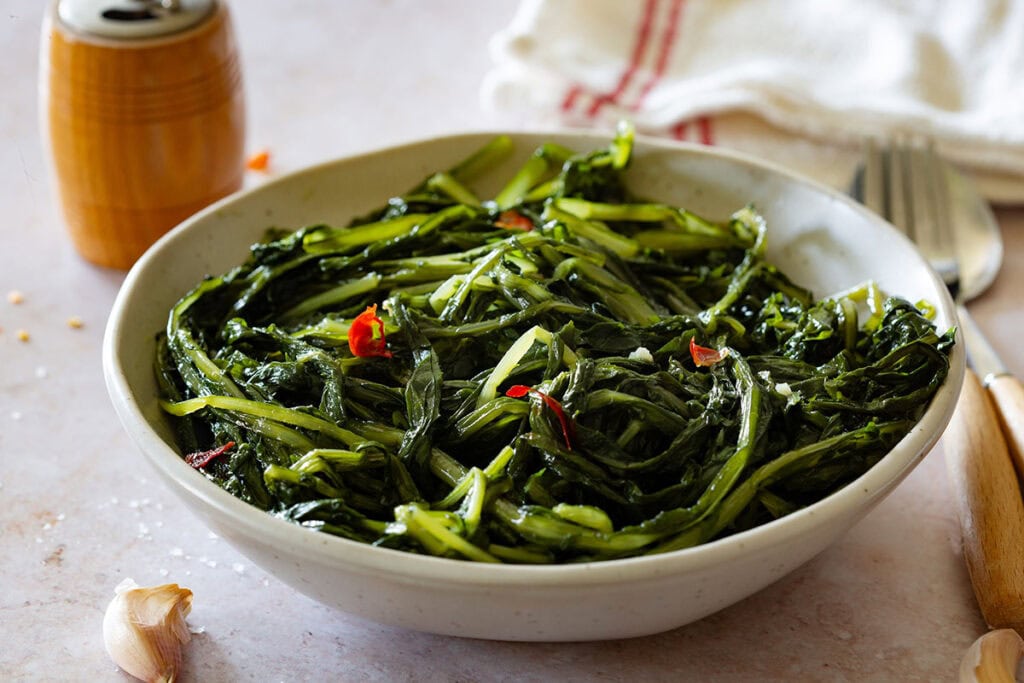 Sauteed wild chicory in a bowl (cicoria ripassata).