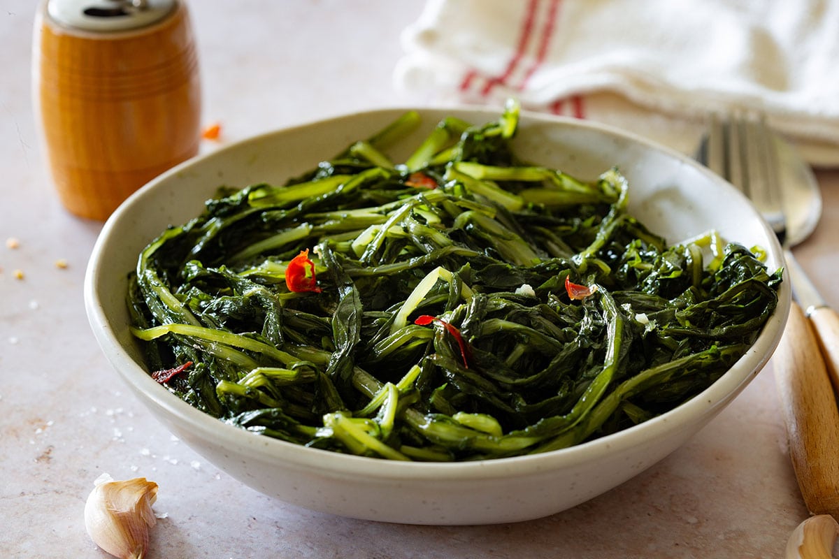 Sautéed wild chicory in a bowl (cicoria ripassata).