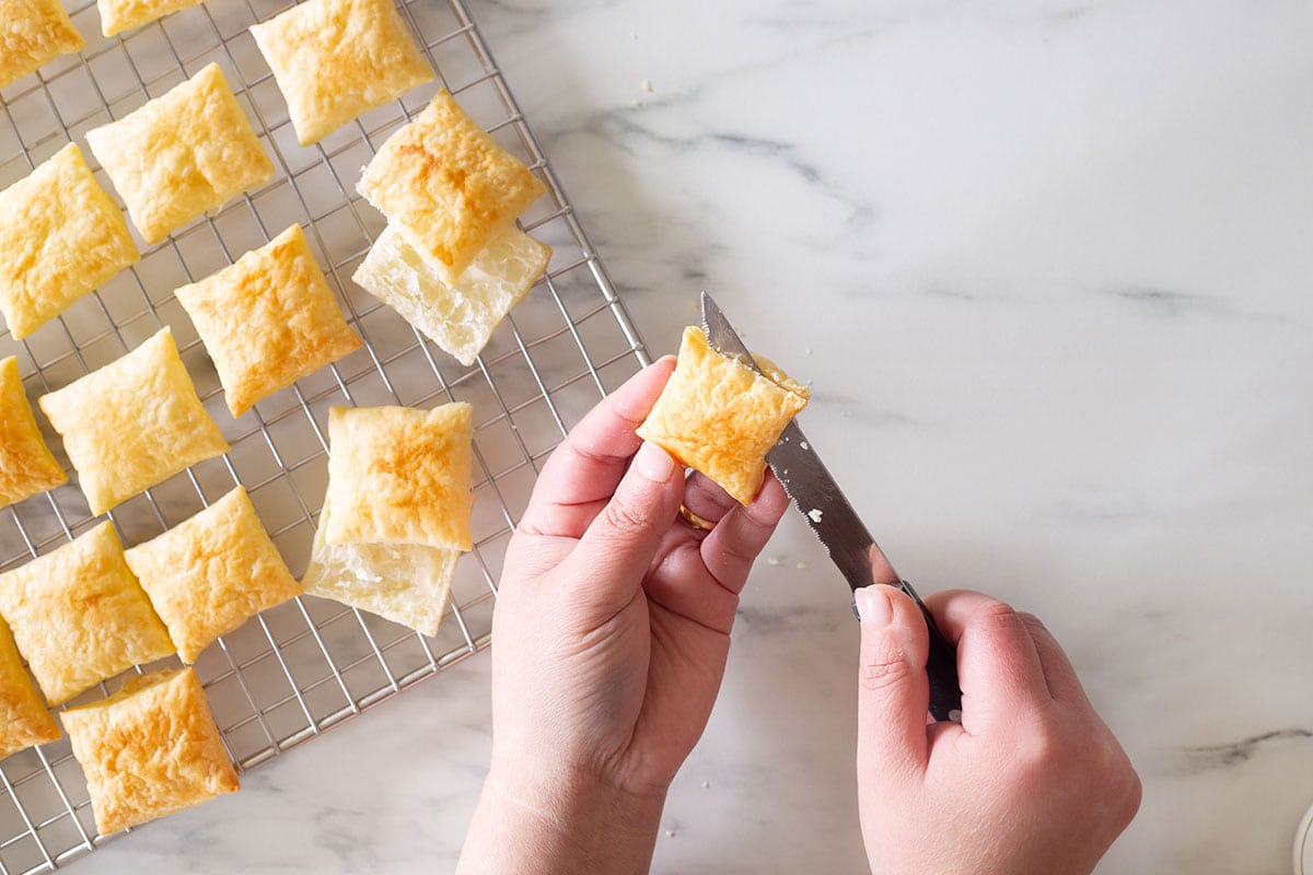 Cutting in half a puff pastry square.