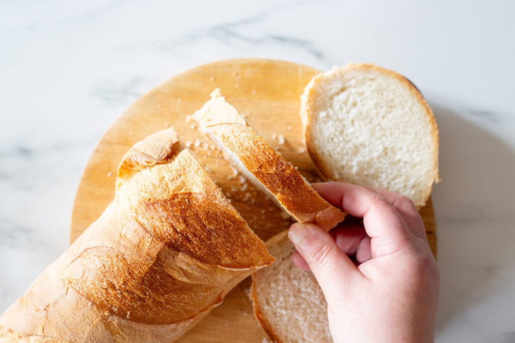 Bread sliced on a cutting board.