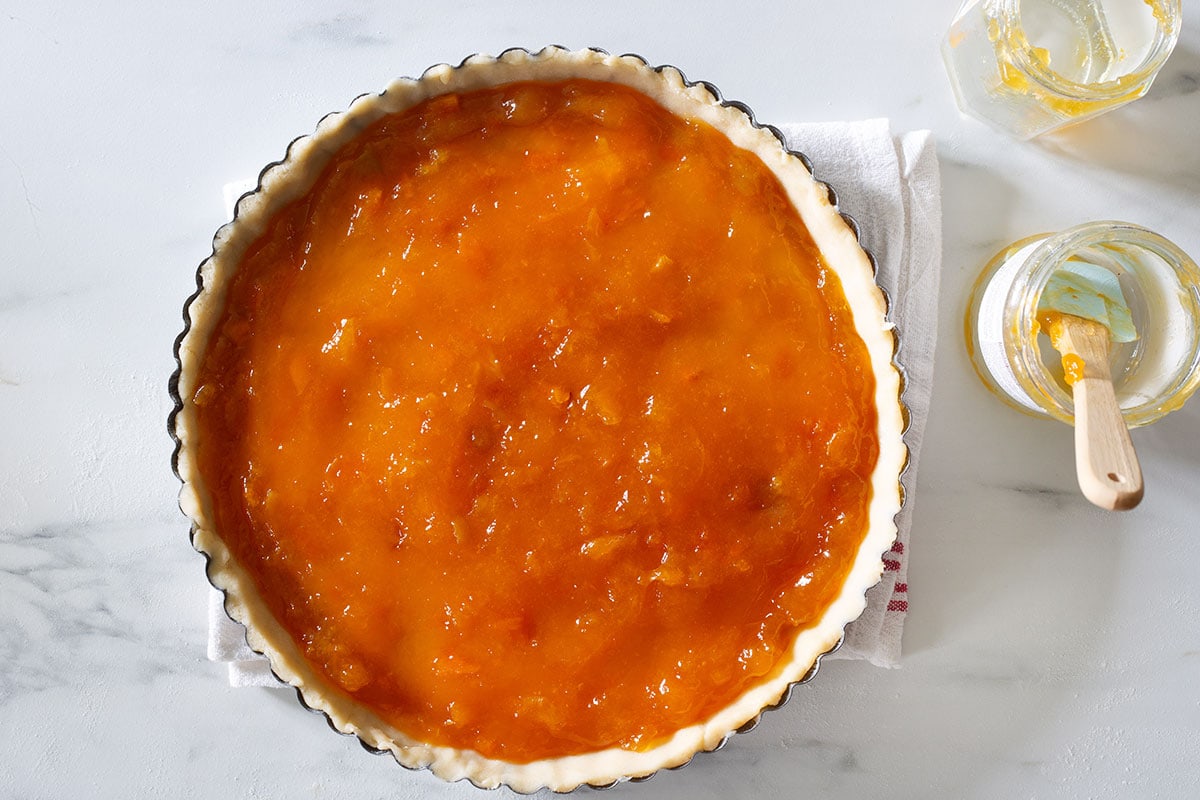 The jam spread inside the tart.