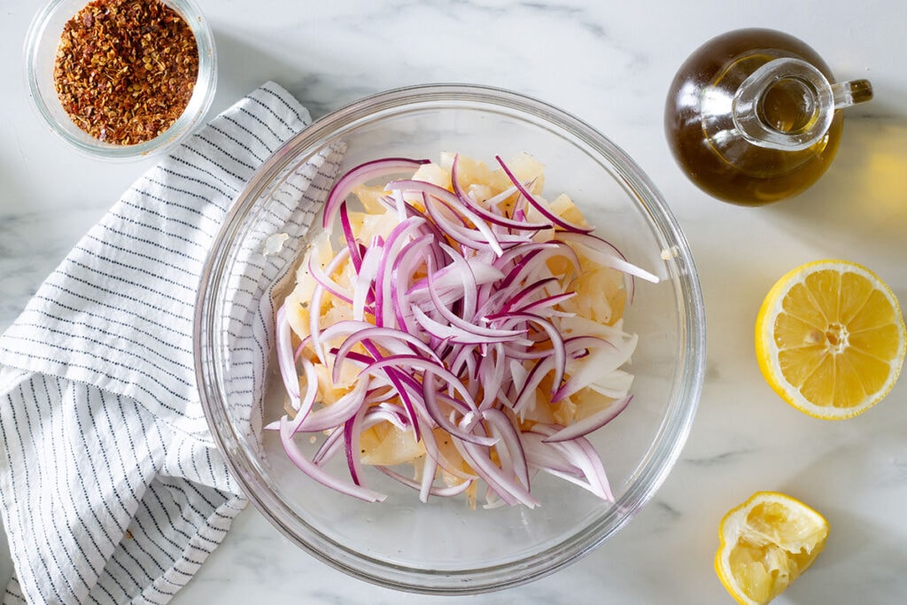 Sliced onion added to the bowl with the cartilage.