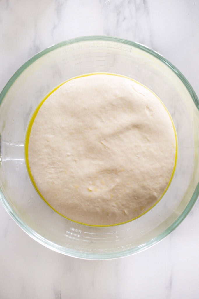 The dough raised on a bowl.
