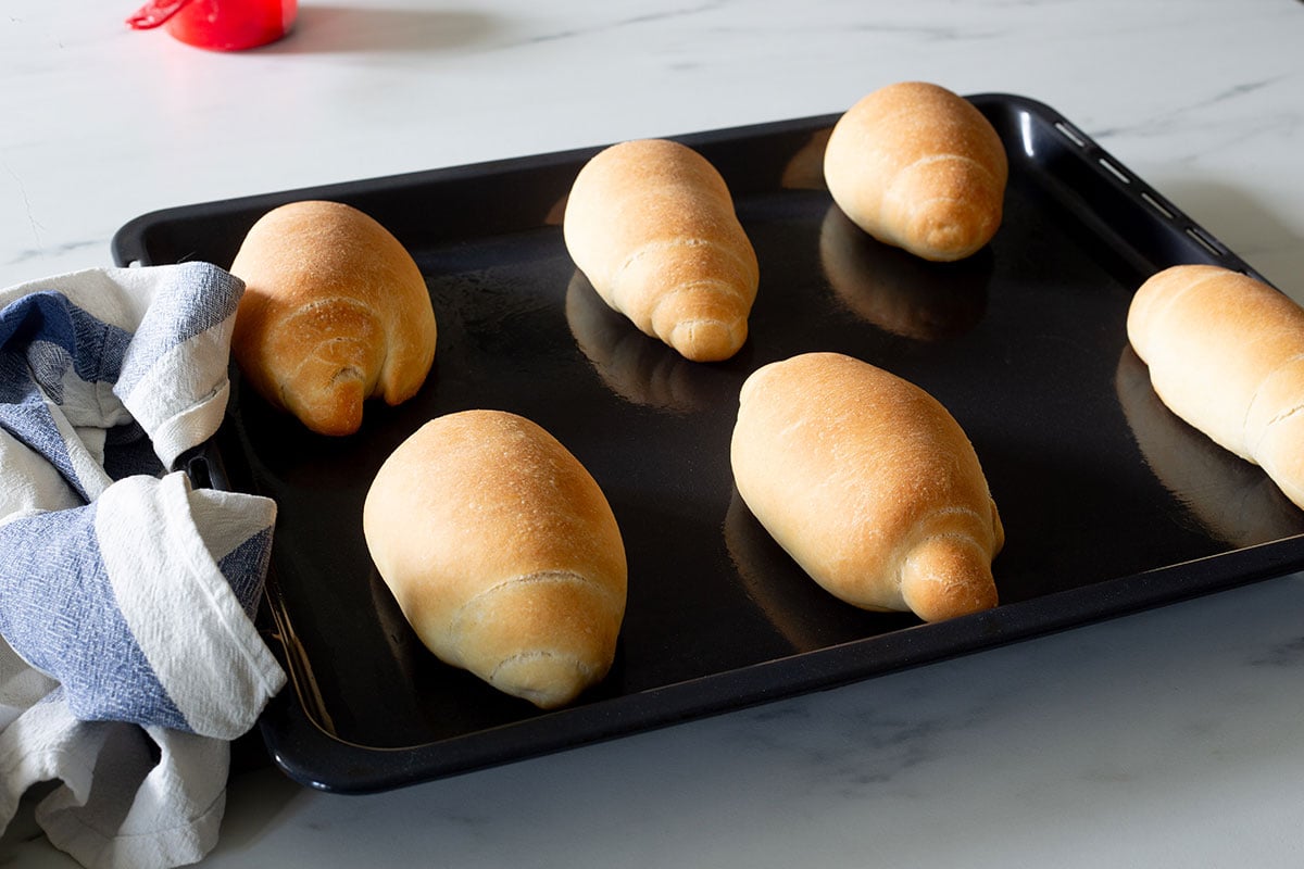 The panini all'olio freshly baked on a baking tray.