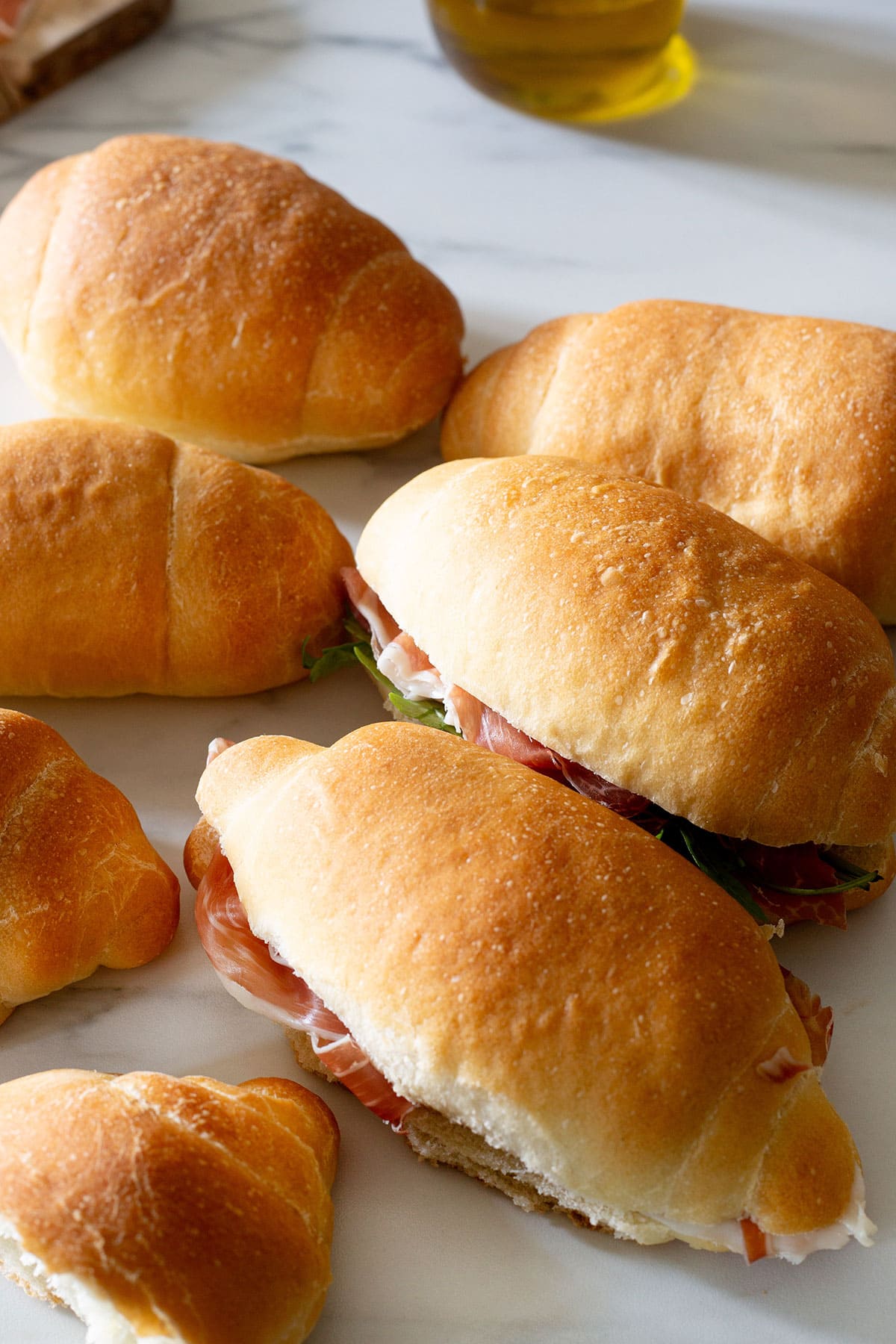 Panini all'olio rolls stuffed with various cold cuts.