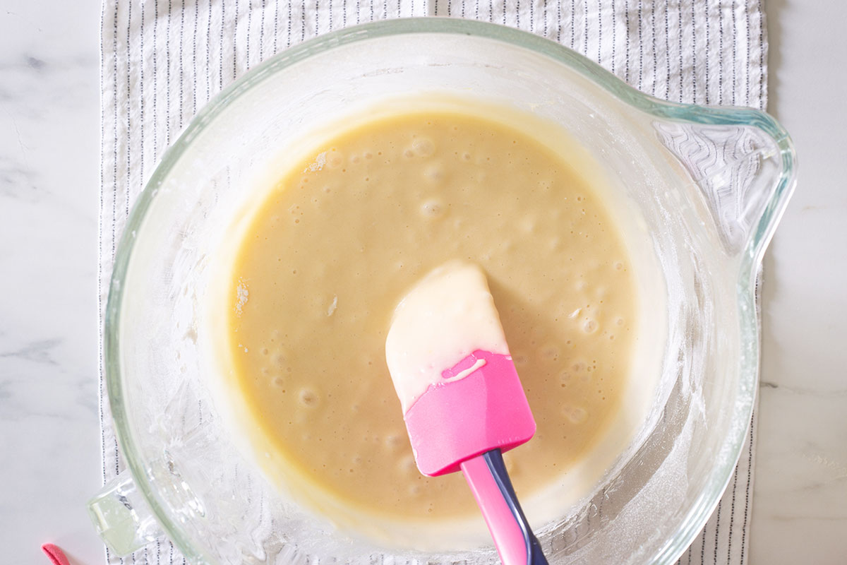 Showing the smooth batter with a spatula.
