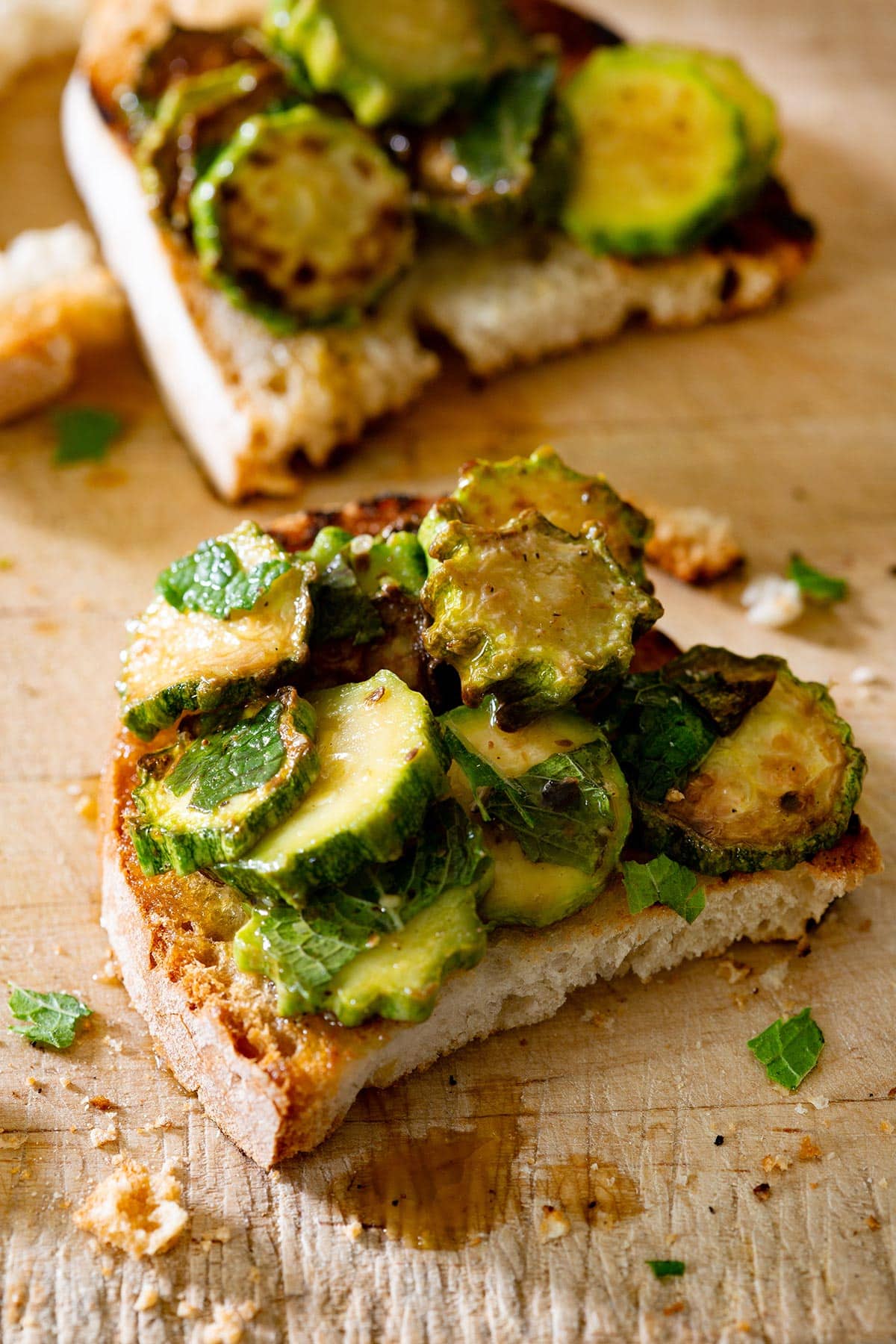 A bruschetta topped with zucchine alla scapece.