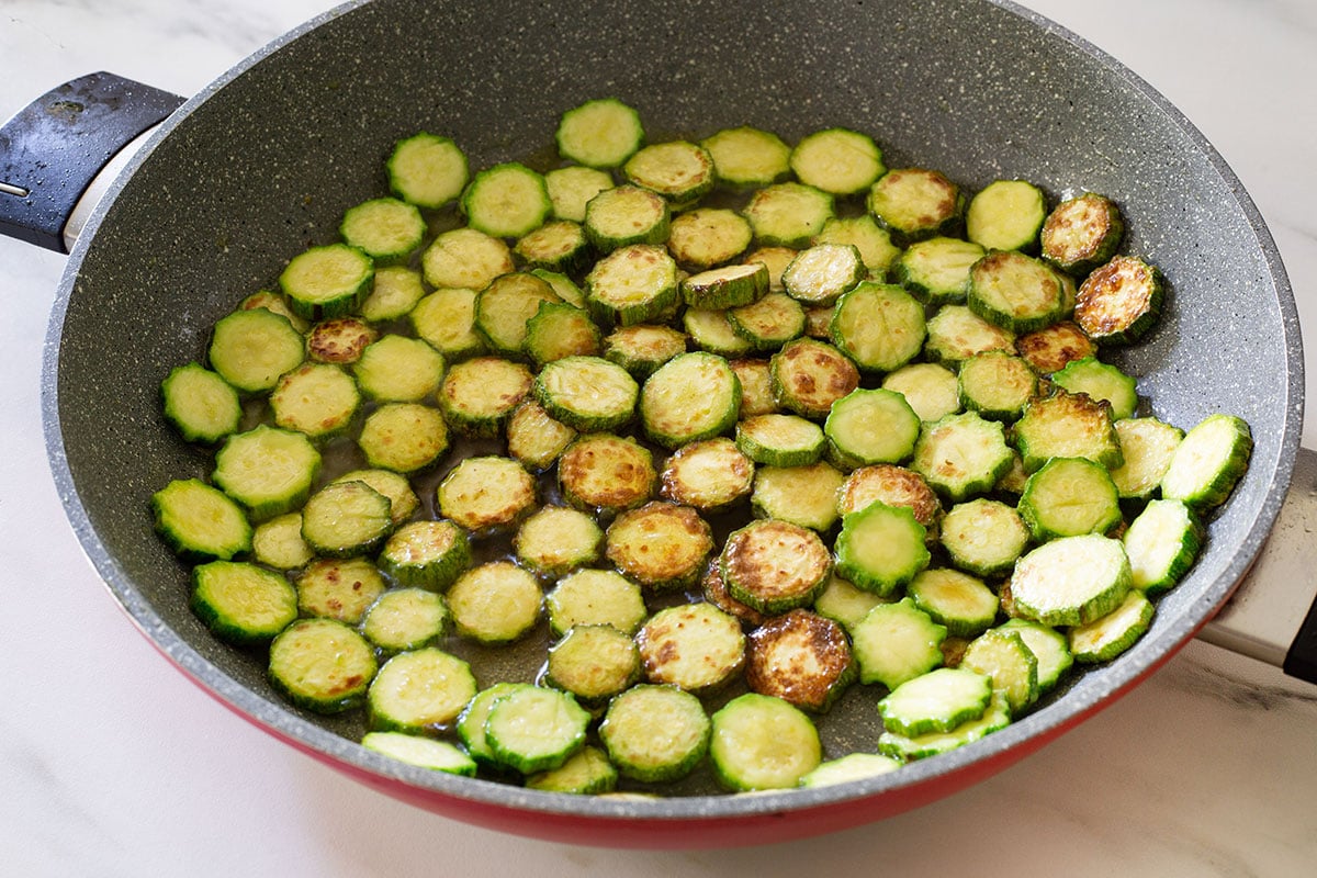 Zucchini fried in a pan.