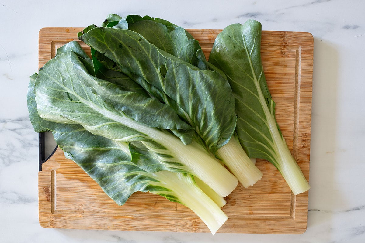 Swiss chard (bietola) cleaned, on a cutting board.