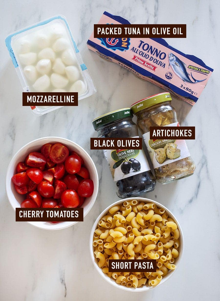 Ingredients for pasta fredda con tonno on a kitchen countertop.
