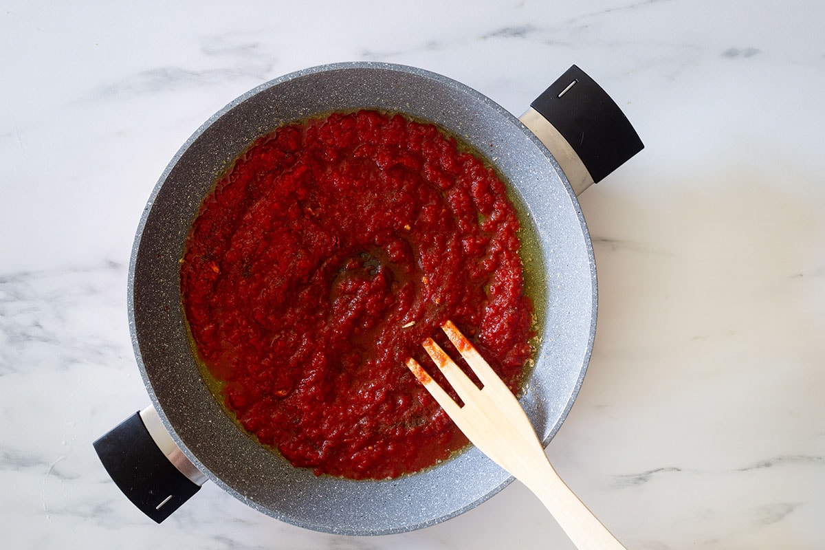 Tomato sauce cooking in a pan.
