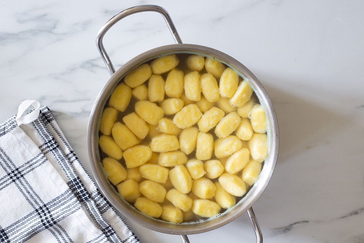 Boiled gnocchi in a pot.